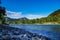 The view from the rocky coast of the wide river and mountain views