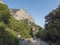 A view of rocky hiking path to Cala Goloritze beach, limestone rocks. Famous travel destination. Gulf of Orosei, Sardinia, Italy,