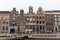 View on Rokin Canal, Oude Turfmarkt street and Tourboats ready for canal cruises in Amsterdam, Holland, Netherlands.