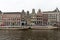 View on Rokin Canal, Oude Turfmarkt street and Tourboats ready for canal cruises in Amsterdam, Holland, Netherlands.