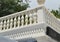 View of the romantic white balcony, terrace with balusters, white stone railing