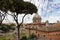 View of Rome from the Capitoline hill.Behind the trees, the Church of Santa Maria Aracoeli against the background of the city and