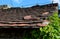 View of the roof made of red brick burnt tiles of the beaver type. the tiles overlap several times, they look like beaver teeth da