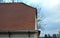 View of the roof made of red brick burnt tiles of the beaver type used in Central Europe on all historical roofs, especially in Au