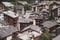View of the roofs of chalets in a Swiss resort. A place preserving authentic architecture. Natural stone roofs, wooden