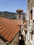 View on roofs, tower and mountains in the old town of Kotor, Montenegro