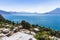 View of rooftops, volcanoes & Lake Atitlan, Guatemala