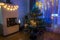 View of room with Ð¡hristmas decoration and view of traditional advent candlestick with four lighted candle.