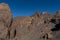 View of Roques de GarcÃ­a unique rock formation with famous Pico del Teide mountain volcano summit in the background on a sunrise