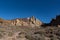 View of Roques de GarcÃ­a unique rock formation with famous Pico del Teide mountain volcano summit in the background on a sunrise