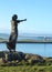 View from Rosses Point from behind silhouette of statue across channel