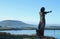 View from Rosses Point from behind silhouette of statue across channel