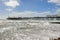 View of rough sea and Brighton pier in UK