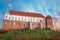 View of the Royal Castle in Sandomierz in Poland, gently lit by the rays of the setting sun