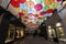 View of Royal Village decorated with umbrellas. It is located near Madeleine in 8th district. Paris. France.