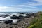 A view of the rugged Oregon coast with waves crashing against the shore in the beautiful coastal town of Yachats, Oregon