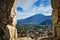 view from ruin Bastione's window to town Riva del Garda with mountains, buildings,  blue cloudy sky