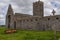 A view of the ruins of Clare Abbey a Augustinian monastery just outside Ennis, County Clare, Ireland that sits alongside the