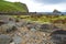 View of the ruins of Duntulm Castle and Tulm Island from the colorful beach of Duntulm Bay in the northern part of the Trotternish