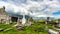 View of the ruins of the medieval church of Killilagh and the graveyard in the village of Doolin