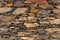 View of a rustic and old schist exterior wall, architectural textures, detailed wall masonry schist