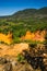 View of Rustrel Village and Bay from the Colourful Ochres of the Provencal Colorado in France