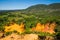 View of Rustrel Village and Bay from the Colourful Ochres of the Provencal Colorado in France