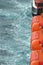 View of safety lifeboats against the background of the sea close up