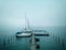 View of sailboats at the dork on a foggy day