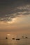 View on the sailboats in the ocean on the sunset in the golden light, close to the beach of Morro Jable on the Canary Island