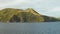 View from sailing boat, beautiful uninhabited island in the middle of the ocean.