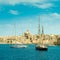 View of sailing boats with Valletta cityscape on the background