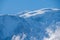 View from Saint-Gervais-les-Bains to white top of Mont Blanc mountaine range in summer