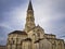 View of the Saint Jean d Estampes church in La Brede, France against a cloudy sky