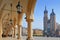 View of Saint Mary`s Basilica from Cloth Hall building Sukiennice on main market square of Cracow, Poland.