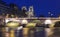 The view of Saint-Michel bridge and the Seine River at night, Paris, France.