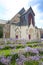View of the Saint-Nazaire Church in beautiful bluebell gardens, Saint Nazaire, Loire-Atlantique, Brittany, France.