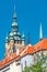 View of Saint Thomas Church main bell tower at blue sky background, Prague, Czech Republic, summer