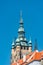 View of Saint Thomas Church main bell tower at blue sky background, Prague, Czech Republic, summer