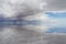 View of Salar De Uyuni Saltflats, water reflecting sky and mount