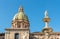 View of San Giuseppe dei Teatini church dome with statue of the Pretoria fountain ahead in Palermo, Sicily.