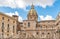 View of San Giuseppe dei Teatini church dome with statue of the Pretoria fountain ahead in Palermo, Sicily.