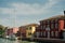 View of the San Michele Arcangelo bell tower and the colorful houses of Mazzorbo, Venice - sep, 2021