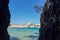 View of San Nicola Island trought the rock of cala delle arene beach in San Domino island