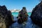 View of San Nicola Island trought the rock of cala delle arene beach in San Domino island