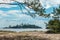 View from a sand beach with pine trees on a island on Ladoga lake in Karelia