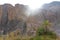 View of sand rock mountains gorge desert valley against sunset, green nature oasis landscape in Africa in summer, natural