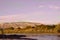 View of the Sandia Mountains and the Bosque along the Rio Grande River at sunset in Albuquerque, New Mexico