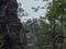 View of sandstone pillars from viewpoint Monchskanzeland at spruce tree forest close to village Oybin and Zittauer