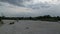 View of the sandy banks of a small river under a cloudy sky